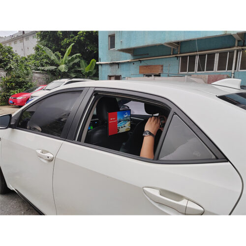 14 inch Android taxi headrest display installed on a vehicle seat for passenger advertising.