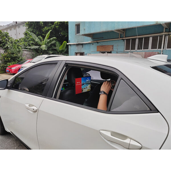 14 inch Android taxi headrest display installed on a vehicle seat for passenger advertising.