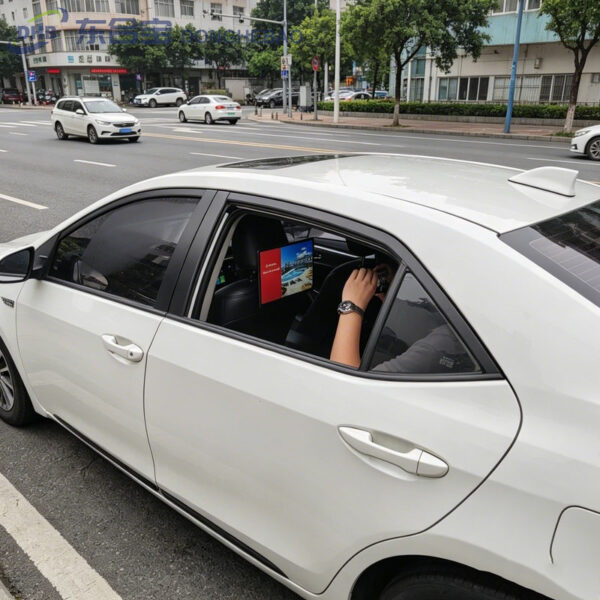 14 inch Android taxi headrest display installed on a vehicle seat for passenger advertising.